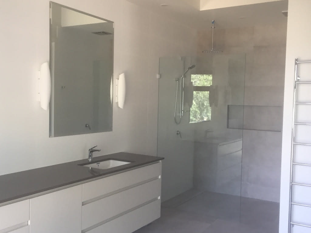 Bathroom With Glass Shower And Mirror