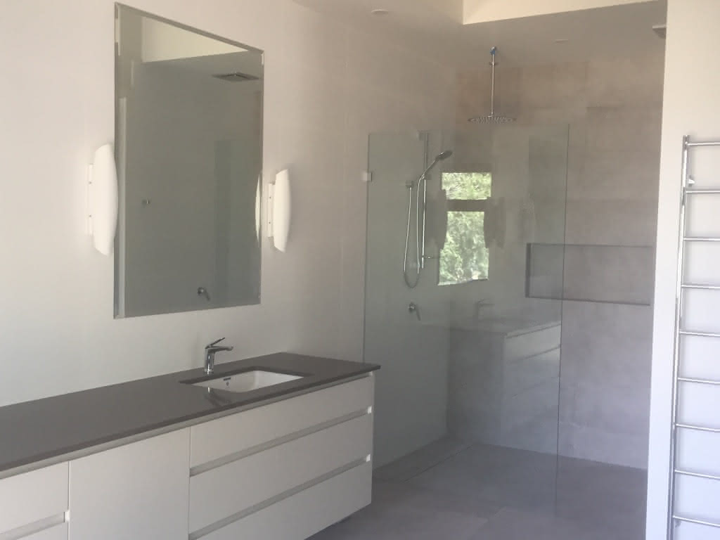 Bathroom with glass shower and mirror